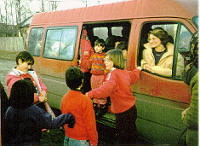 Our van step is our pulpit where
the children preach and sing